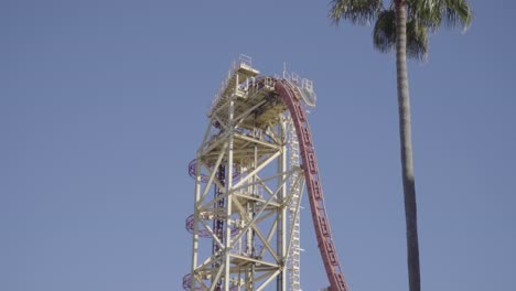 Epic-footage-of-a-roller-coaster-climbing-a-lift-hill-and-plunging-down-a-large-drop