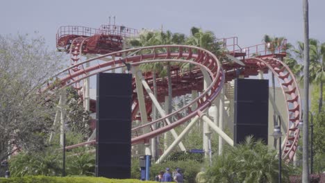 Close-up-shot-of-a-roller-coaster-twisting-and-turning-through-steel-track