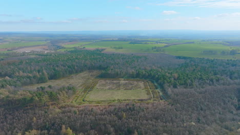 CAWTHORNE-Roman-Camp,-Pickering-,-Aerial-Footage,-North-York-moors-National-Park,-Push-toward-and-pan-down-on-roman-camp-earthworks