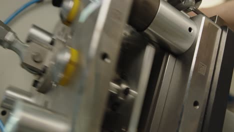 Aluminum-lids-pressing-machine-working-in-a-modern-factory-close-up