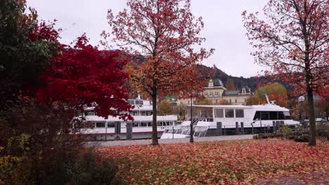 Bregenz-lake-promenade-in-autumn---Lake-Constance-with-a-Boat---rainy-day