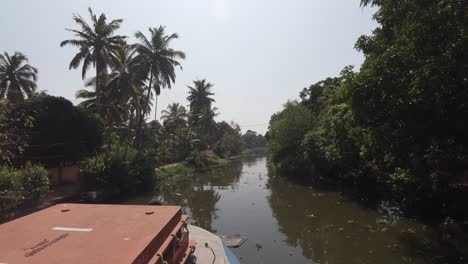 View-from-sailing-boat-on-canal-at-Alappuzha-or-Alleppey,-India