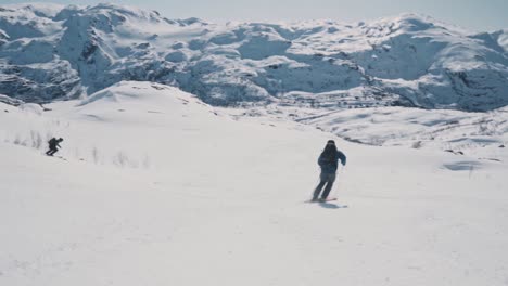 Skier-flies-by-at-full-speed-down-snowy-slope-in-Norway,-Vatnahalsen