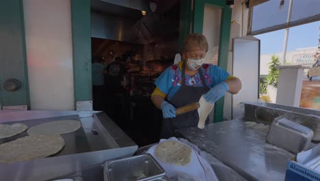 Older-Mexican-lady-making-fresh-tortilla's