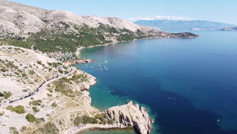 Oprna-Bay,-Krk-Island,-Kvarner,-Croatia---Aerial-Drone-View-of-the-Coastal-Road-Along-the-Adriatic-Sea