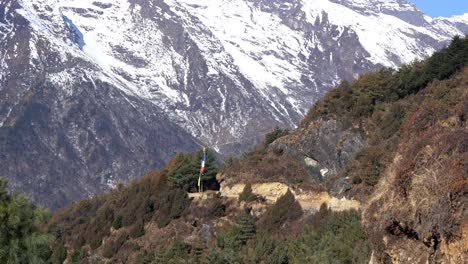 A-view-of-a-mountain-trail-and-a-prayer-flag-in-the-Himalaya-Mountains-on-the-Everest-Base-Camp-trail