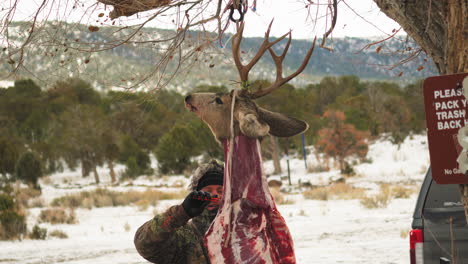 Dead-flayed-buck-hanging-from-a-tree
