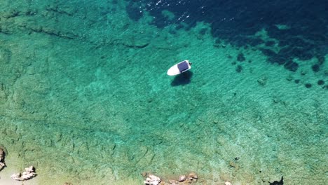 Aerial-Drone-View-of-a-Boat-and-Turquoise-Crystal-Clear-Adriatic-Sea---Krk-Island,-Kvarner,-Croatia
