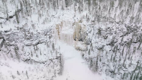 Aerial-View-Of-Frozen-Waterfall-And-Forest-In-Korouoma-Nature-Reserve-At-Posio,-Finland