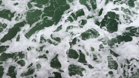Close-up-of-white-ocean-water-foam-from-above-in-the-Mediterranean-Sea