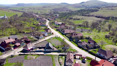 Drone-view-over-the-main-road-in-the-village-of-Tiocu-de-Sus-near-Cluj-Napoca-city-in-Romania