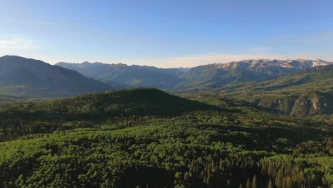 Drone-Aerial-View-Of-Lush-Green-Mountain-Valley-Woodlands-Near-Kebler-Pass,-Colorado