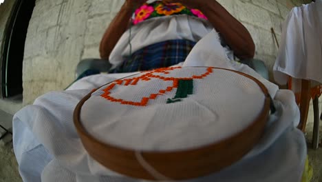 Native-person-making-embroidery-work