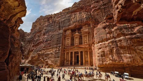 Time-lapse-of-people-at-Petra-Treasury,-the-famous-historic-Nabataeans-UNESCO-heritage-site-carved-into-sandstone-in-Jordan
