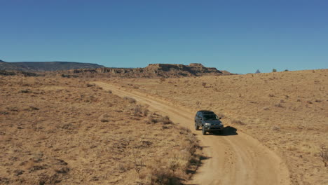 Aerial-as-Toyota-4Runner-SUV-drives-offroad-in-desert-landscape
