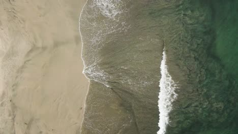 4K-Drone-Crashing-Waves-On-White-Sandy-Beach-Shore