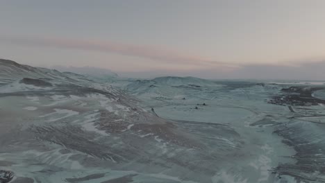 Beautiful-Sunset-Colors-over-Snowy-Tundra-Landscape-of-Iceland,-Aerial