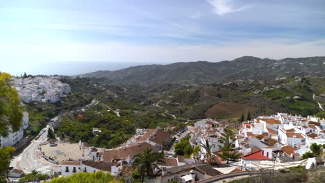 Pan-over-beautiful-whitewashed-village-of-Montefrio-with-hills-in-distance