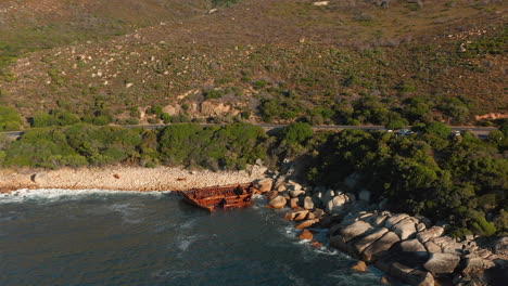Shipwreck-On-Rocky-Coastline-Of-Beach-In-Cape-Town,-South-Africa