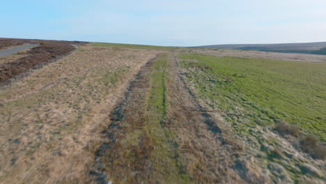 North-York-Moors-Roman-Road,-between-Stape-and-Egton,-ancient-trackway-trod,-history,-aerial-drone-push-forward-along-path-of-track-mavic-3-Cine-prores-422-Clip-1