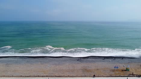 Drone-4k-footage-of-a-rocky-beach-in-Lima,-Peru