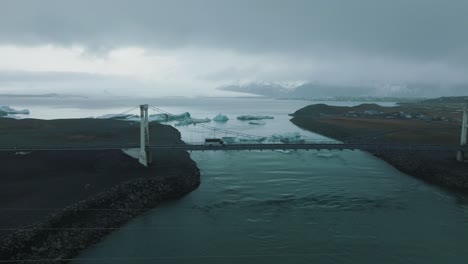 Bridge-over-River-on-Snaefellsnes-Coast-in-Iceland-on-Moody-Day,-Aerial