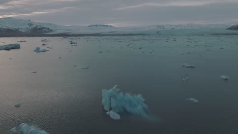 Dramatic-Iceland-Landscape-with-Floating-Glacier-Icebergs-in-Water,-Aerial