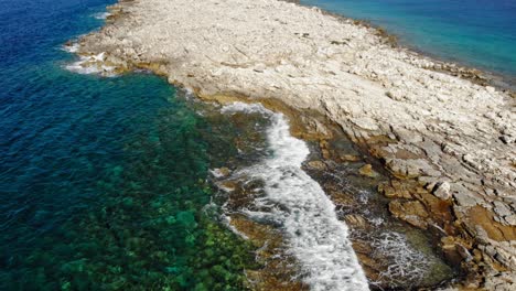 Rocky-Seaside-Surface-Of-Paralia-Emplisi,-Kefalonia-Greece--Aerial