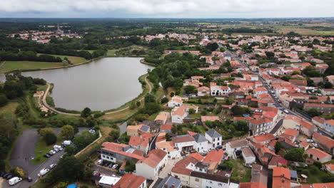 Aerial-drone-view-of-Talmont-Saint-Hilaire-town-and-lake,-France