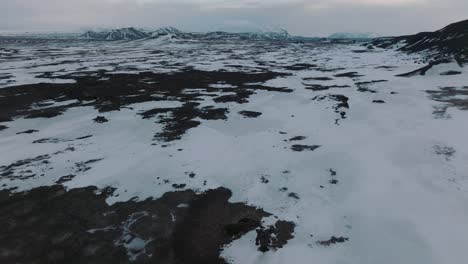 The-Frigid,-Rugged-Terrain-of-Iceland-during-Snowy-Winters,-Aerial