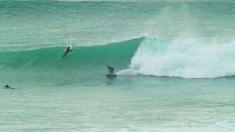 Surfer-Riding-Waves-On-The-Ocean-In-Chapel-Porth,-Cornwall,-UK---slow-motion