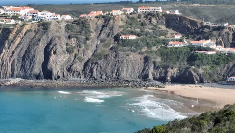 Aerial-shot-of-beautiful-white-villas-and-apartments-on-top-of-rugged-cliffs-in-a-secluded-bay