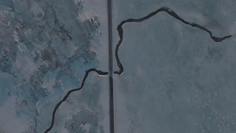 Highway-Road-over-Frozen-Ice-River-in-Iceland---Aerial-Drone-Top-View