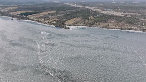 Lake-Magog-Covered-With-Ice-With-Panorama-Of-Province-In-Quebec,-Canada