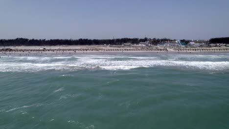 Side-aerial-view-of-the-waves-and-the-beach-of-Tampico