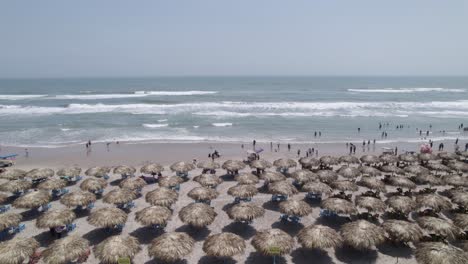 Many-people-in-the-palapas-in-Tampico-beach