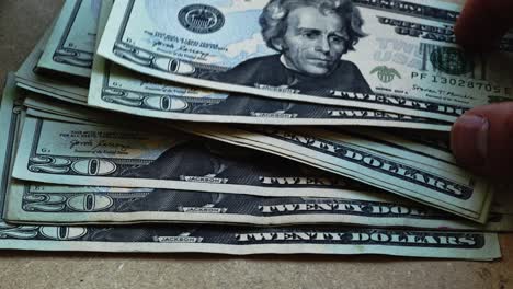 Andrew-Jackson-in-20-dollar-bills-USDs-spread-out-4k