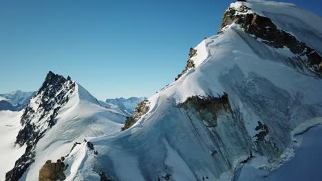 Mountain-peak-cover-with-a-glacier-in-the-swiss-alps,-Saas-Fee