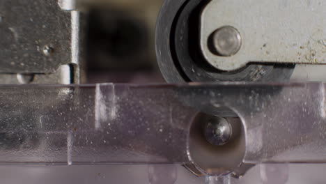 Extreme-Close-Up-Of-Microcassette-Pinch-Roller-Spinning
