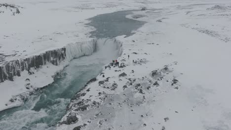 Aerial-Static-view-of-People-Sightseeing-at-Dettifoss-Waterfall,-Iceland