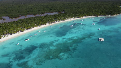 Catamarans-and-yachts-anchoring-offshore-tropical-Isla-Saona-coast