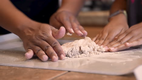Kneading-matzah-dough-to-mix-it-with-flour-and-bake-into-Passover-bread---slow-motion