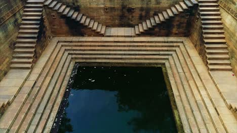 This-landmark-is-a-water-storage-well-and-is-now-a-protected-monument,-Close-up-shot-of-the-amazing-architecture-of-the-patterned-stairs-at-Abhaneri-baori