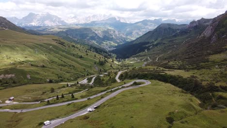 Pordoi-Mountain-Pass-at-Trentino,-South-Tyrol,-Dolomites,-Italy---Aerial-Drone-View-of-the-Hairpin-Bends-and-Green-Valley-in-the-Italian-Alps