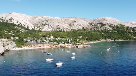 Krk-Island,-Croatia---Aerial-Drone-View-of-the-Coast-of-Oprna-Bay-with-Boats,-Campsite-and-Beaches-at-the-Adriatic-Sea