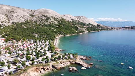 Campsite-at-Krk-Island,-Croatia---Aerial-Drone-View-of-the-Mountains-and-Coast-with-Boats,-Beaches-and-Adriatic-Sea