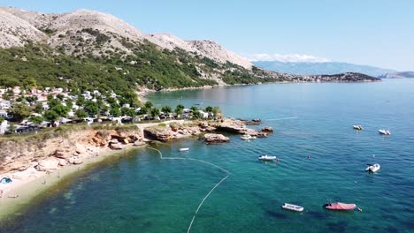 Krk-Island,-Croatia---Coast-of-Oprna-Bay-with-Boats,-Campsite-and-Beaches-at-the-Adriatic-Sea---Aerial-Drone-View