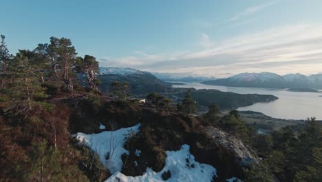 Winter-forestry-mountain-and-majestic-landscape-of-Norway,-aerial-FPV-view