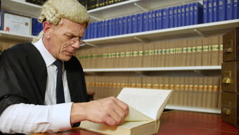 Judge-or-barrister-reading-a-law-book-in-the-Judge's-chambers-library