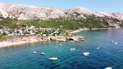 Krk-Island,-Croatia---Aerial-Drone-View-of-the-Coast-with-Boats,-Campsite-and-Beaches-at-the-Adriatic-Sea